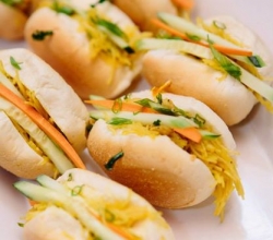 "Filipino Sliders" Spring noodles with chicken, in a Traditional Filipino Sweet Roll garnished with fresh cucumber and carrots.